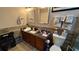 Bathroom with a vanity, two mirrors, and a toilet with tile backsplash and walls at 3338 Robert Trent Jones Dr # 30704, Orlando, FL 32835