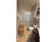 Bathroom featuring a walk-in shower with glass doors, neutral tile, and classic fixtures at 3338 Robert Trent Jones Dr # 30704, Orlando, FL 32835