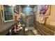 Bathroom featuring tiled walk-in shower and dark granite countertops at 3338 Robert Trent Jones Dr # 30704, Orlando, FL 32835