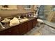 Modern bathroom featuring walk-in shower with granite countertop and decorative towels at 3338 Robert Trent Jones Dr # 30704, Orlando, FL 32835