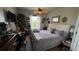 Bedroom with a ceiling fan, and decor on the walls with a view from the window at 3338 Robert Trent Jones Dr # 30704, Orlando, FL 32835