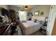 A comfortable bedroom with a spacious bed, ceiling fan and light-colored flooring at 3338 Robert Trent Jones Dr # 30704, Orlando, FL 32835