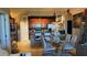 Open kitchen with dark wood cabinets, stainless steel appliances and an adjacent dining area at 3338 Robert Trent Jones Dr # 30704, Orlando, FL 32835