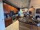 Modern kitchen features stainless steel appliances, granite countertops, and tile flooring at 3338 Robert Trent Jones Dr # 30704, Orlando, FL 32835