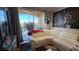 Inviting living room featuring a plush white sectional sofa and access to a private balcony at 3338 Robert Trent Jones Dr # 30704, Orlando, FL 32835