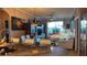 Bright living room with a large sectional sofa, ceiling fan, and sliding glass doors to the outside at 3338 Robert Trent Jones Dr # 30704, Orlando, FL 32835