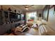 Bright living room featuring a large entertainment center, a comfortable sectional sofa, and a ceiling fan at 3338 Robert Trent Jones Dr # 30704, Orlando, FL 32835