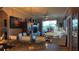 Bright open-concept living room, with a dining room and a view of the outside at 3338 Robert Trent Jones Dr # 30704, Orlando, FL 32835