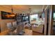 A vibrant living room with a glass dining table and large, comfortable white couch and light hardwood floors at 3338 Robert Trent Jones Dr # 30704, Orlando, FL 32835