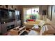 Bright living room featuring a large entertainment center, a comfortable sectional sofa, and a ceiling fan at 3338 Robert Trent Jones Dr # 30704, Orlando, FL 32835