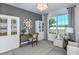 Bright home office with a large window, built-in shelves, and comfortable seating at 3406 Haven Side Rd, Davenport, FL 33837