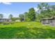 Spacious back yard with lush grass and a partial fence to maintain privacy at 3685 Sunday Dr, Deltona, FL 32738