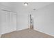 Bright bedroom featuring tile floors, a closet, and a door to another room at 3685 Sunday Dr, Deltona, FL 32738