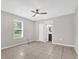 Serene bedroom with a ceiling fan, natural light, and tile flooring at 3685 Sunday Dr, Deltona, FL 32738