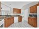 Efficient kitchen features a dishwasher, ample cabinet space, and connection to an adjoining room at 3685 Sunday Dr, Deltona, FL 32738