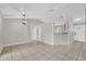 Bright living room with neutral paint, tile floors, and an open layout, ready for personalization at 3685 Sunday Dr, Deltona, FL 32738