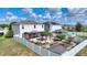 Aerial view of fenced-in backyard with pergola, gazebo, and pool at 372 Willet St, Haines City, FL 33844