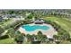 Aerial view of the community pool, pool house, and landscaped grounds at 372 Willet St, Haines City, FL 33844