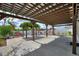 Backyard pergola with concrete patio and manicured landscaping at 372 Willet St, Haines City, FL 33844