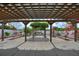 Backyard pergola with concrete patio and manicured landscaping at 372 Willet St, Haines City, FL 33844