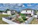 Aerial view of a landscaped backyard with stone pathways, garden beds, and a privacy fence for serene outdoor living at 372 Willet St, Haines City, FL 33844