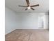 Spacious bedroom with neutral carpet, a ceiling fan, and ample natural light from large windows at 372 Willet St, Haines City, FL 33844