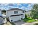 Two-story home with a two-car garage, well-manicured lawn, and inviting curb appeal at 372 Willet St, Haines City, FL 33844