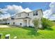 Two-story home with attached garage and landscaped yard at 372 Willet St, Haines City, FL 33844