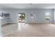 Open living area with sliding glass doors to backyard with carpet and tile at 372 Willet St, Haines City, FL 33844