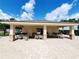 Outdoor kitchen with stainless steel grill, seating, and restrooms at 372 Willet St, Haines City, FL 33844