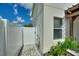 An outdoor shower with privacy gate with direct access from outside the house at 372 Willet St, Haines City, FL 33844
