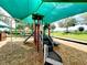 Community playground equipment for children at 372 Willet St, Haines City, FL 33844