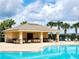The community pool has a nearby outdoor kitchen and dining area at 372 Willet St, Haines City, FL 33844