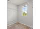 Walk-in closet with ample storage space and a window providing natural light at 372 Willet St, Haines City, FL 33844