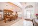 Bright entryway featuring tile flooring, an arched window, and a decorative front door at 3843 Beacon Ridge Way, Clermont, FL 34711