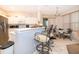 Kitchen featuring ample counter space, bar seating, and modern appliances at 3843 Beacon Ridge Way, Clermont, FL 34711