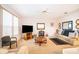 Spacious living room with carpet, ceiling fan, and plenty of natural light at 3843 Beacon Ridge Way, Clermont, FL 34711
