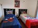 Whimsical bedroom with twin beds, themed decor, and a cozy atmosphere at 4031 Calabria Avenue, Davenport, FL 33897