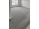 Spacious bedroom with neutral carpet and a large window at 4062 Serene Water Ave, Eustis, FL 32736