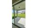 View from covered patio with a large grassy backyard, perfect for outdoor entertaining at 4062 Serene Water Ave, Eustis, FL 32736