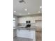 Modern kitchen featuring white cabinets, subway tile backsplash, and stainless steel appliances at 4062 Serene Water Ave, Eustis, FL 32736