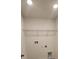 Laundry room with a wire shelf and electrical outlets at 4062 Serene Water Ave, Eustis, FL 32736
