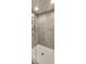 Modern walk-in shower featuring tiled walls, glass door and rainfall shower head at 4062 Serene Water Ave, Eustis, FL 32736