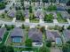Aerial view of home with a private pool and in a community with mature trees at 420 Tulipwood Ln, Chuluota, FL 32766