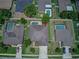 Aerial view of home with a private pool, patio area, and manicured landscaping at 420 Tulipwood Ln, Chuluota, FL 32766