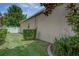 Manicured backyard with green lawn, privacy fence, and lush landscaping at 420 Tulipwood Ln, Chuluota, FL 32766