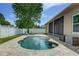 Relaxing backyard with an outdoor pool and lounge chairs at 420 Tulipwood Ln, Chuluota, FL 32766