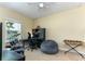 Bedroom featuring musical equipment, a window, and neutral-colored walls at 420 Tulipwood Ln, Chuluota, FL 32766