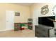 Bright bedroom features ample storage with a dresser, closet, decorative wall art, and a ceiling fan at 420 Tulipwood Ln, Chuluota, FL 32766