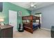 Bedroom featuring a wooden bunk bed, ceiling fan, and green and blue walls at 420 Tulipwood Ln, Chuluota, FL 32766